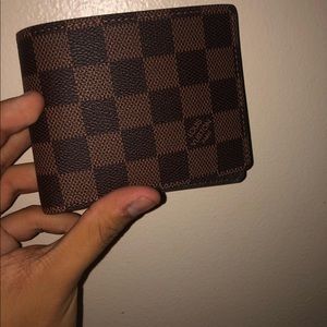 Authentic Louis Vuitton brown monogram wallet.